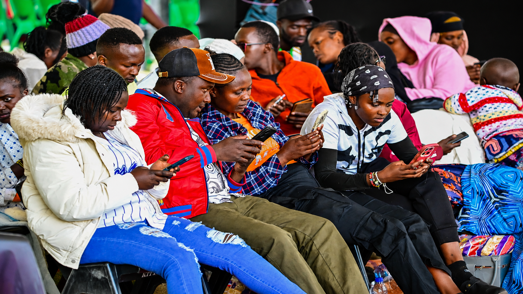 Young entrepreneurs access digital registration and programme information during the NYOTA Business Support Programme rollout in the Nanyuki Cluster serving Laikipia, Isiolo, and Samburu counties.