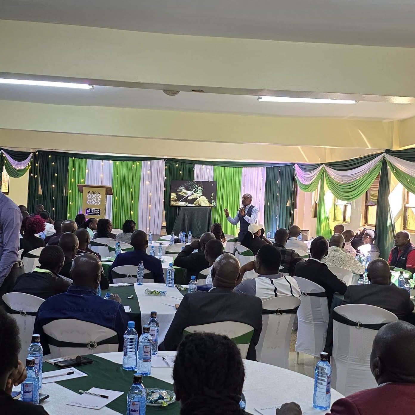 Co-operative Bank MSME engagement meeting with entrepreneurs in western Kenya discussing business growth and financial support.